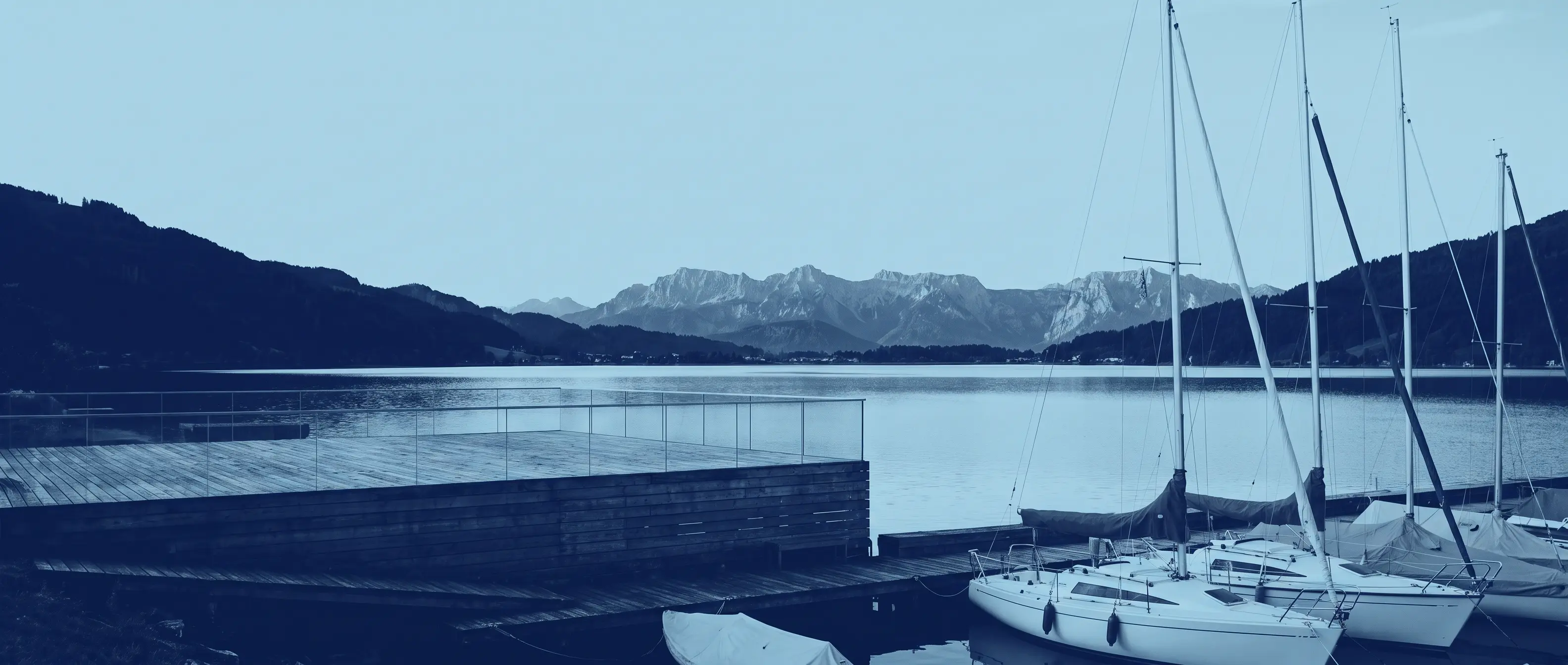 Segelboote am Bodensee mit Alpenpanorama, Symbolbild für POS Kassenlösungen bei Vereinen